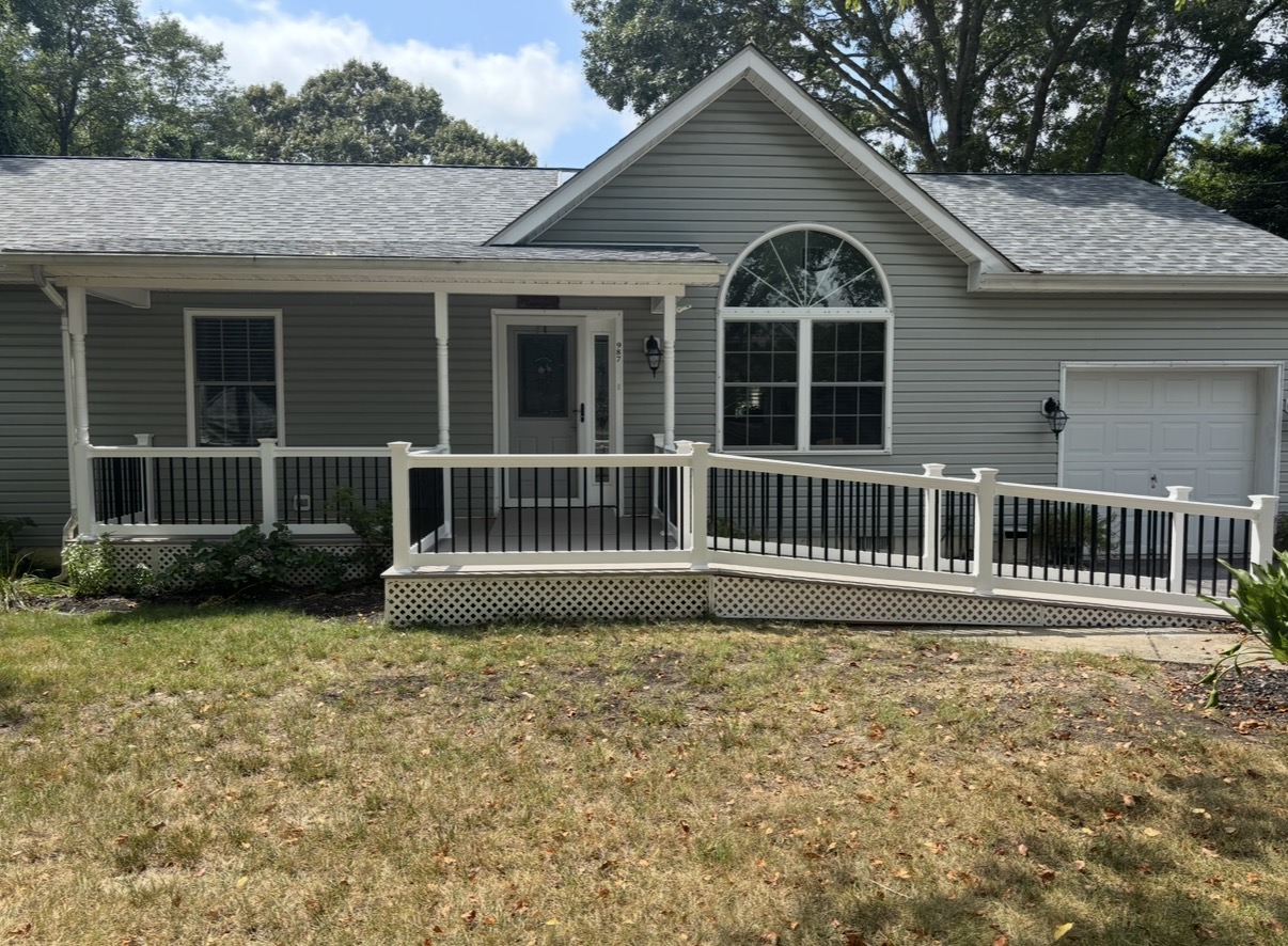 Front view of completed shore-home porch with composite decking and accessible ramp