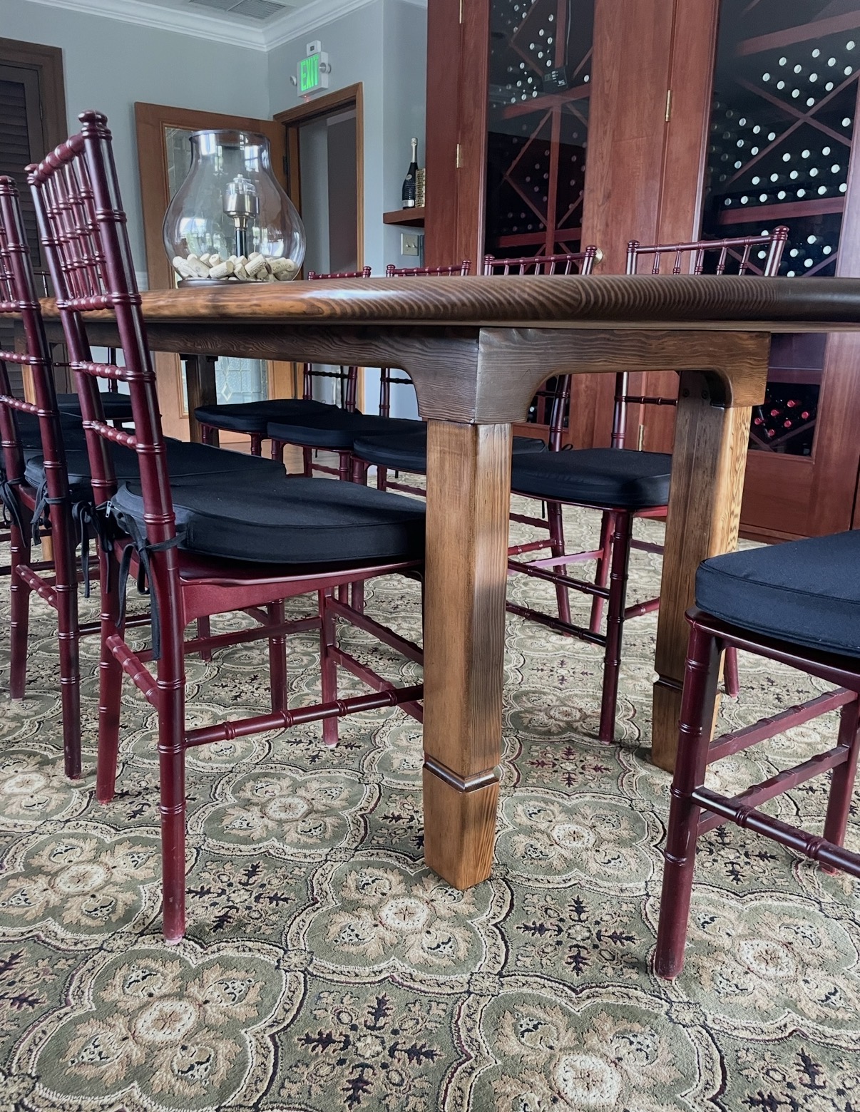 Detail of the finished hand-shaped table leg and apron with rich amber stain